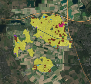 Ein Satellitenbild von mit farbcodierten Gebieten, die Primäres Heizsystem nach Gebäudeblock aggregiert dargestellen.
